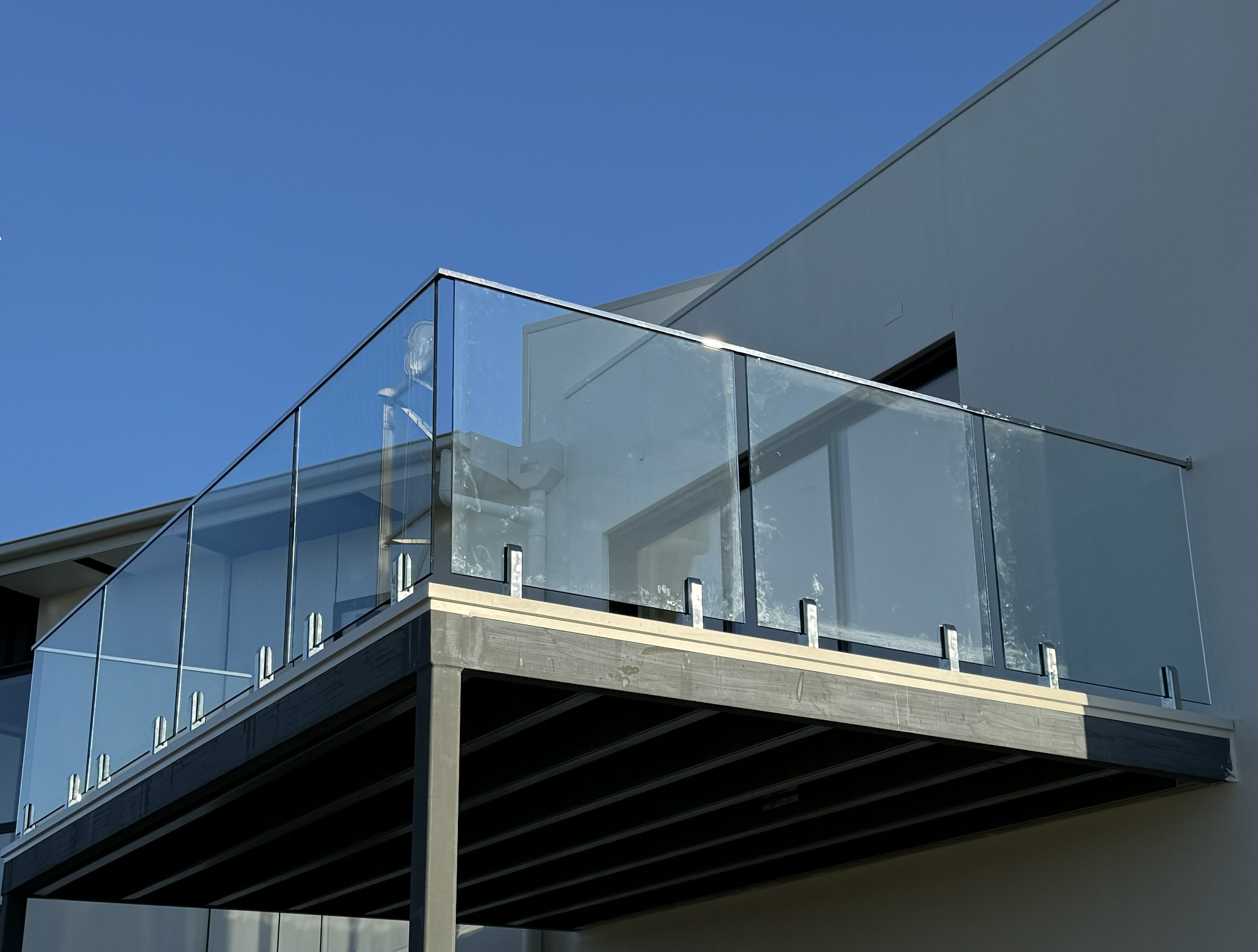 Frameless glass balustrade on a deck in Devonport